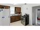 Well-equipped kitchen featuring classic cabinets, modern appliances, and efficient layout for culinary adventures at 95 S 11Th Ave, Beech Grove, IN 46107