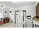 Eat-in kitchen with ceiling fan, white appliances, and a functional layout at 95 S 11Th Ave, Beech Grove, IN 46107