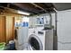 The basement laundry room includes a washer, dryer, and storage at 95 S 11Th Ave, Beech Grove, IN 46107