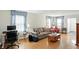 Comfortable living room featuring ample seating, natural light, and hardwood floors for a cozy atmosphere at 95 S 11Th Ave, Beech Grove, IN 46107