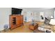 Spacious living room with hardwood floors, a vintage cabinet, and neutral furniture for a homey feel at 95 S 11Th Ave, Beech Grove, IN 46107
