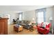 Bright living room featuring a comfortable couch, hardwood floors, and blue accents for a relaxing vibe at 95 S 11Th Ave, Beech Grove, IN 46107
