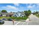 A view of the house, lawn, and street from across the street at 95 S 11Th Ave, Beech Grove, IN 46107