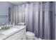Well-lit bathroom with a granite vanity, modern fixtures, and a clean, functional design at 9628 Gull Lake Dr, Indianapolis, IN 46239