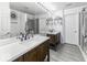 Bright bathroom with dual vanities, modern fixtures, and a glass-enclosed shower for a spa-like experience at 9628 Gull Lake Dr, Indianapolis, IN 46239