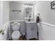 Cozy half-bathroom featuring traditional fixtures and a neutral color palette at 9628 Gull Lake Dr, Indianapolis, IN 46239