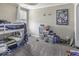 Functional bedroom with bunk beds, storage shelves, and playful decor, perfect for  at 9628 Gull Lake Dr, Indianapolis, IN 46239