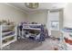 Functional bedroom with bunk beds, storage shelves, and playful decor, perfect for  at 9628 Gull Lake Dr, Indianapolis, IN 46239