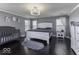 Serene bedroom features a king bed, a cozy rug, and ample natural light from multiple windows at 9628 Gull Lake Dr, Indianapolis, IN 46239