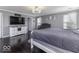 Serene bedroom features a king bed, a cozy rug, and ample natural light from multiple windows at 9628 Gull Lake Dr, Indianapolis, IN 46239