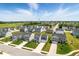 An elevated view highlighting the home's location in a well-maintained neighborhood with lush greenery at 9855 Oakmont E E Dr, Pendleton, IN 46064