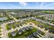 Neighborhood aerial showcasing a community with beautiful homes, a pond, and well-planned streets at 9855 Oakmont E E Dr, Pendleton, IN 46064