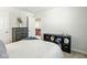 Bedroom presents a neat bed, a dresser and sports memorabilia for a personalized touch at 9855 Oakmont E E Dr, Pendleton, IN 46064