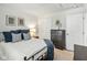 Bedroom displays a neatly arranged bed, chest of drawers, and decor for a cozy atmosphere at 9855 Oakmont E E Dr, Pendleton, IN 46064