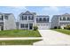 Charming two-story home featuring a manicured lawn and a two-car garage with a concrete driveway at 9855 Oakmont E E Dr, Pendleton, IN 46064