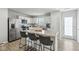 Contemporary kitchen featuring white cabinets, stainless steel appliances, and a convenient island with seating at 9855 Oakmont E E Dr, Pendleton, IN 46064