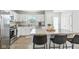 Modern kitchen boasting white cabinetry, stainless steel appliances, and a central island with bar seating at 9855 Oakmont E E Dr, Pendleton, IN 46064