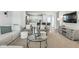 Bright and airy living room with stylish decor and an open layout connecting to the kitchen and dining area at 9855 Oakmont E E Dr, Pendleton, IN 46064