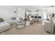 Bright and inviting living room with modern furnishings and an open-concept design leading to the kitchen at 9855 Oakmont E E Dr, Pendleton, IN 46064