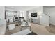 Cozy living room showcasing contemporary design, featuring comfortable seating and a view into the modern kitchen at 9855 Oakmont E E Dr, Pendleton, IN 46064