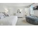 Main bedroom with calming gray tones, large windows, soft carpet, and an ensuite bathroom entrance at 9855 Oakmont E E Dr, Pendleton, IN 46064