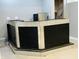 Finished basement wet bar featuring corrugated accents, black face, and counter with integrated sink at 9987 Rainbow Falls Ln, Fishers, IN 46037