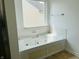 Bathroom with a large bathtub and a window providing natural light at 9987 Rainbow Falls Ln, Fishers, IN 46037