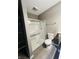 Clean bathroom design featuring walk-in shower with glass enclosure, toilet, and storage shelf at 9987 Rainbow Falls Ln, Fishers, IN 46037