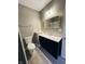 Bright bathroom featuring modern vanity and mirror, toilet, and walk-in shower with glass enclosure at 9987 Rainbow Falls Ln, Fishers, IN 46037