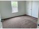 This bedroom features a neutral palette, plush carpet, and plenty of natural light at 9987 Rainbow Falls Ln, Fishers, IN 46037