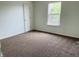 Bedroom with neutral walls, carpet flooring, window for natural light, and closet at 9987 Rainbow Falls Ln, Fishers, IN 46037