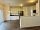 Bright and airy kitchen featuring stainless steel appliances and access to a dining area at 9987 Rainbow Falls Ln, Fishers, IN 46037