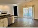 Kitchen with eat-in dining area and sliding glass doors to the screen porch at 9987 Rainbow Falls Ln, Fishers, IN 46037