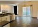 Eat-in kitchen with stainless steel appliances and sliding doors to the backyard at 9987 Rainbow Falls Ln, Fishers, IN 46037