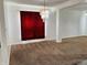 Bright living area with plush carpeting and chandelier at 9987 Rainbow Falls Ln, Fishers, IN 46037