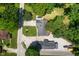 Aerial shot of a property featuring a large driveway, a manicured lawn, and is conveniently located near the main road at 10519 N Antioch Rd, Mooresville, IN 46158