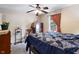 A comfy bedroom offers lots of vintage décor and a beautiful blue bedspread at 10519 N Antioch Rd, Mooresville, IN 46158