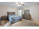 Well-lit bedroom with a full bed and a set of drawers on a neutral-colored carpet at 10519 N Antioch Rd, Mooresville, IN 46158