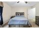 Calm bedroom with a full bed, side table and neutral colored walls and carpet at 10519 N Antioch Rd, Mooresville, IN 46158