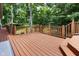 A spacious deck offers ample room for entertaining amidst lush greenery at 10519 N Antioch Rd, Mooresville, IN 46158