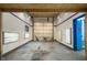 An empty and bright garage has fresh paint and ample square footage at 10519 N Antioch Rd, Mooresville, IN 46158