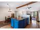 Inviting kitchen and dining area with a blue island, wooden table, and vaulted ceilings at 10519 N Antioch Rd, Mooresville, IN 46158