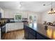 Spacious kitchen with white cabinets, stainless steel appliances, and an island at 10519 N Antioch Rd, Mooresville, IN 46158