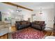 Spacious living room with hardwood floors, comfortable sofas, and a vaulted ceiling at 10519 N Antioch Rd, Mooresville, IN 46158