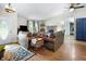 Inviting living room with a brick fireplace, hardwood floors and plush sofas at 10519 N Antioch Rd, Mooresville, IN 46158