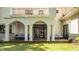 Inviting back patio with comfortable seating, elegant columns, and access to the house at 110 Bow Ln, Indianapolis, IN 46220