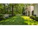 Expansive backyard featuring a well-maintained lawn and mature trees, perfect for outdoor activities at 110 Bow Ln, Indianapolis, IN 46220