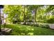 Expansive backyard with lush lawn, mature trees and tasteful landscaping at 110 Bow Ln, Indianapolis, IN 46220