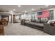 Finished basement with a large sectional sofa and plenty of room for entertainment at 110 Bow Ln, Indianapolis, IN 46220