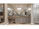Bathroom with custom vanity, stone countertops, and custom tile floors at 110 Bow Ln, Indianapolis, IN 46220